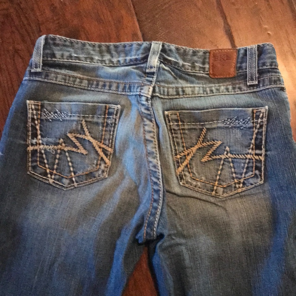 BKE medium wash slightly distressed jeans.